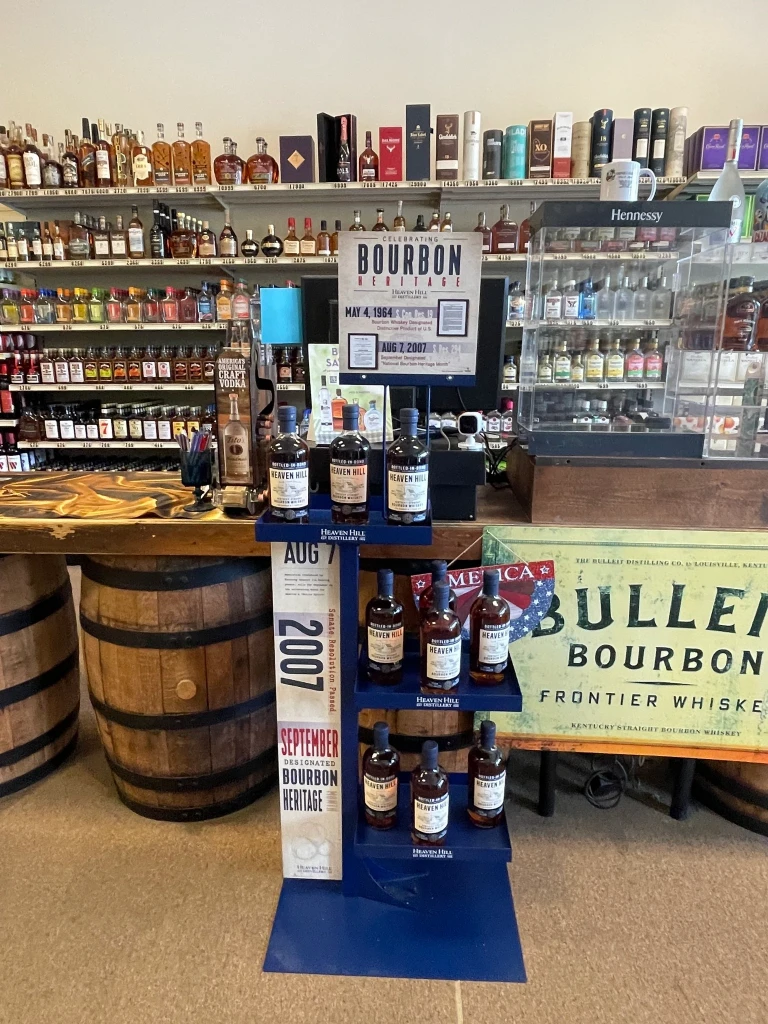 A display of Heaven Hill bourbon bottles showcased in our store next to the register.