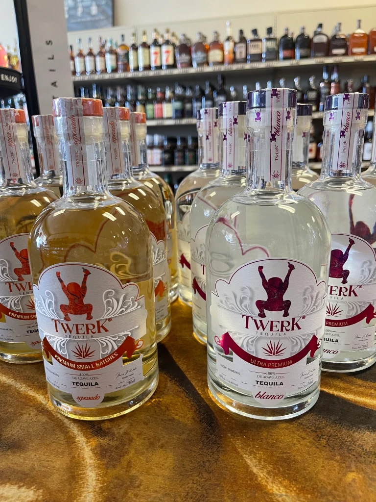A tabletop showcase of Twerk Tequila Blanco and Reposado, a brand new arrival at the store.